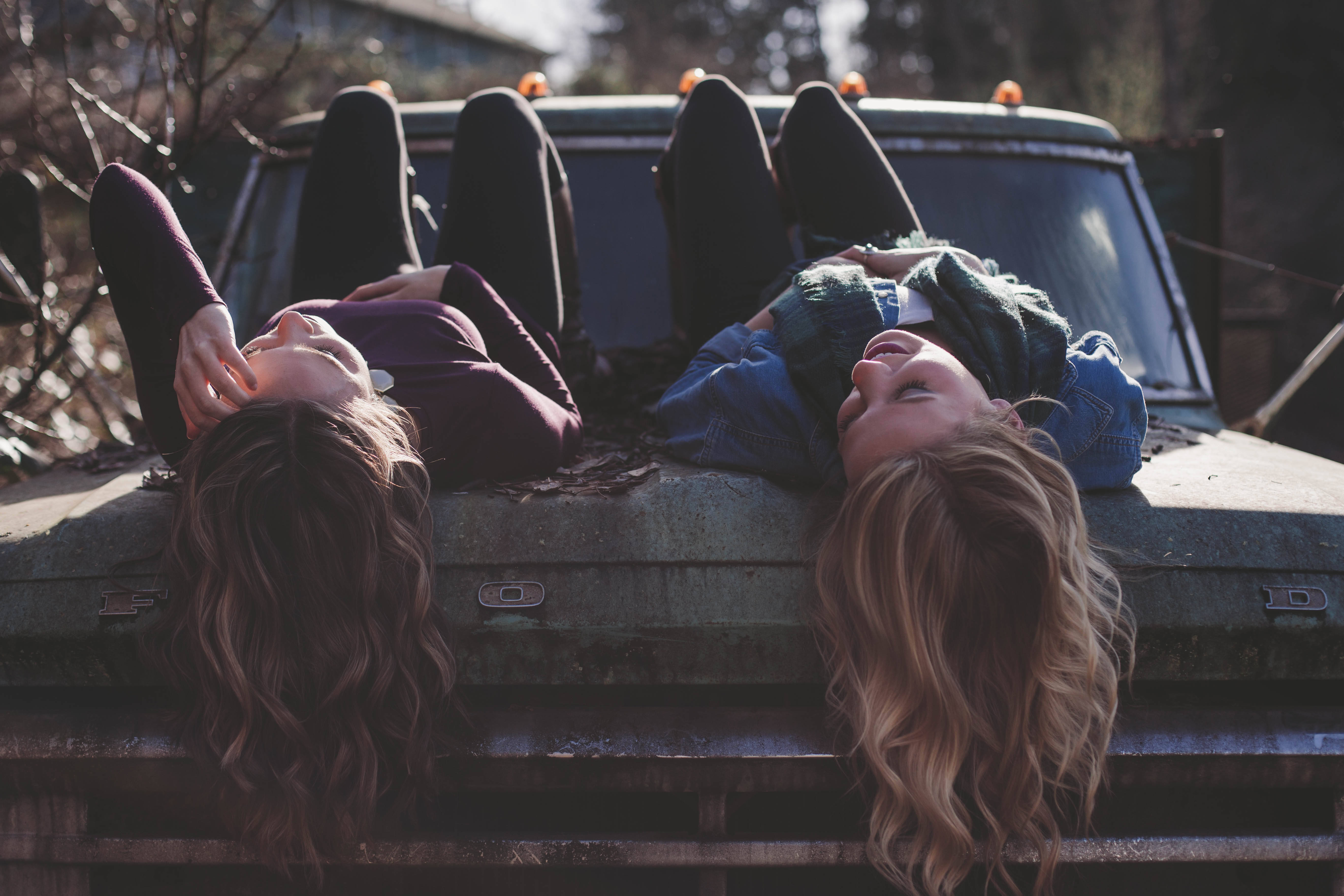 Lesbian Couple Laying On Truck Wallpaper Wallpapersok