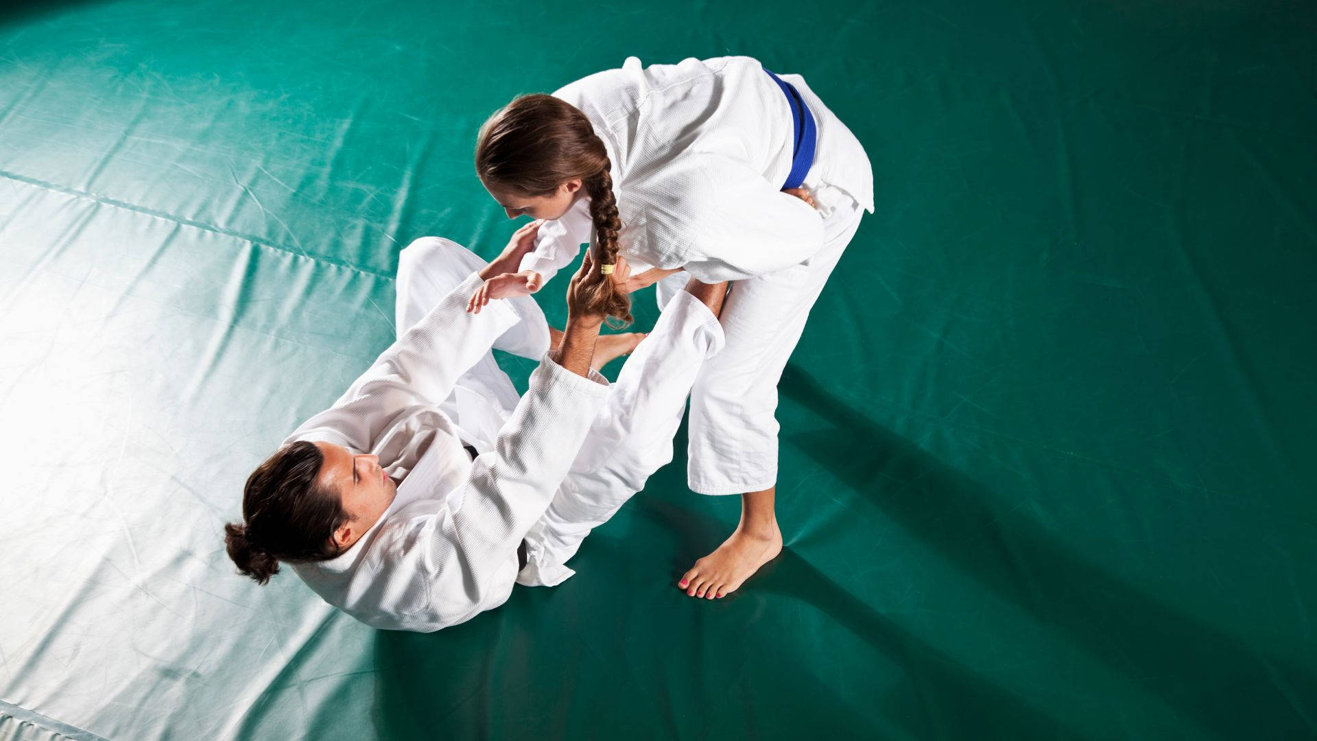 A Captivating Demonstration Of Brazilian Jiu-jitsu Prowess By Both Men And Women Contenders. Wallpaper
