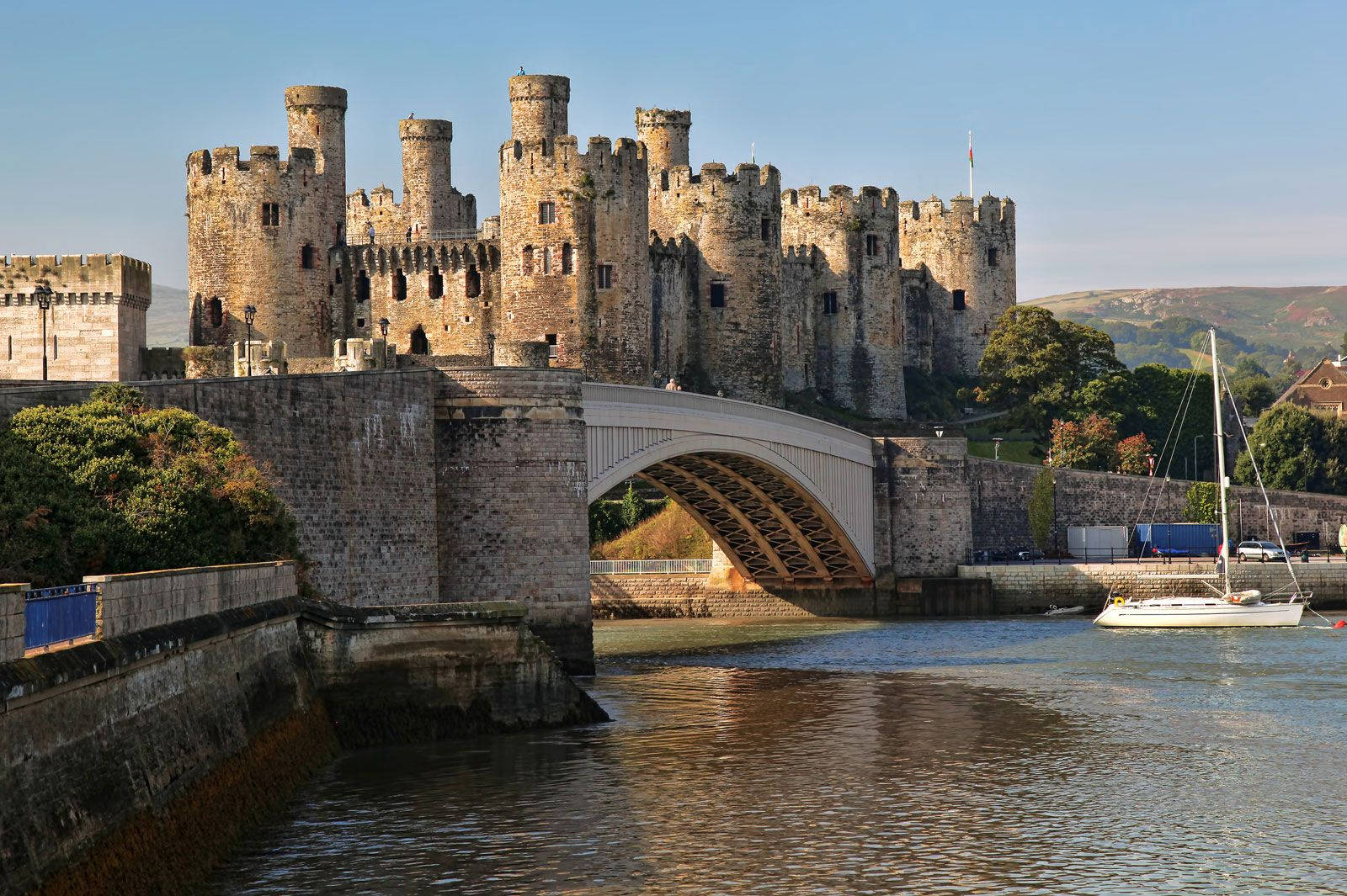 A Castle With A Bridge Over A Body Of Water Wallpaper