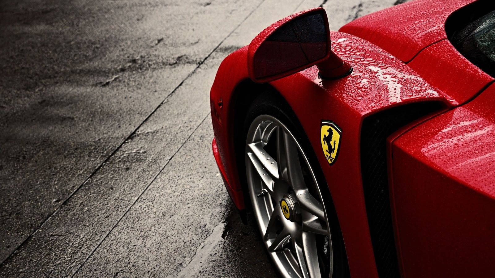 A Ferrari Supercar Drives Through The Rain Wallpaper
