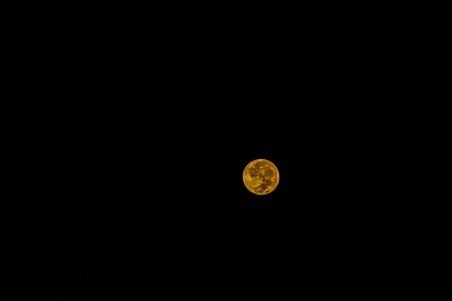 A Monochromatic Night Sky Filled With A Bright Yellow Moon Wallpaper