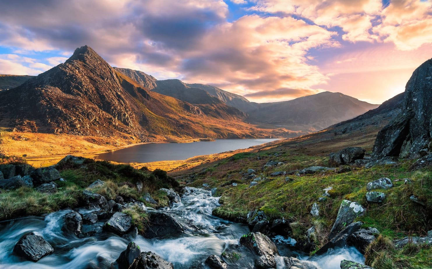 A Mountain Stream Runs Through The Mountains Wallpaper