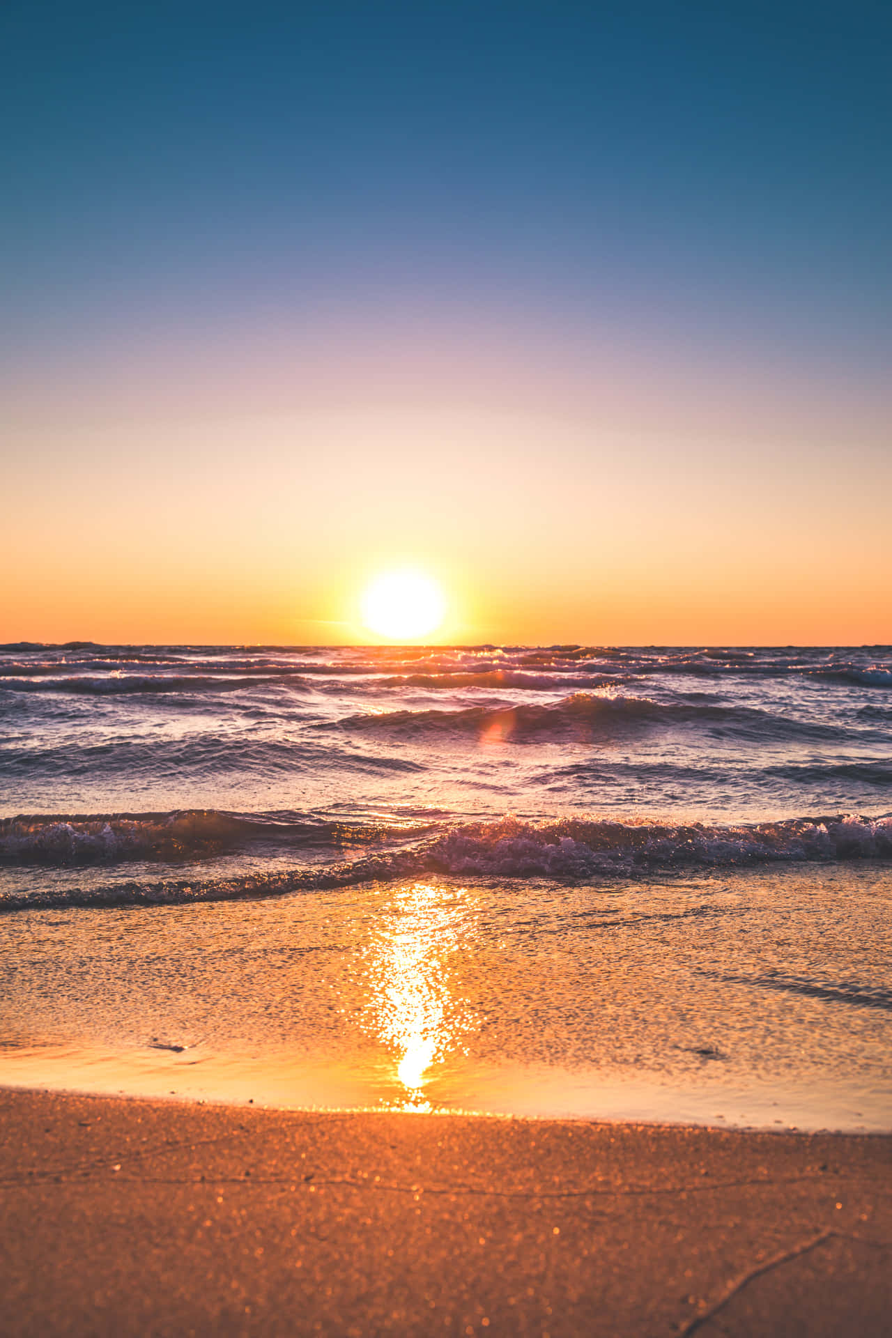 A Peaceful Sunset On A Serene Lake Wallpaper