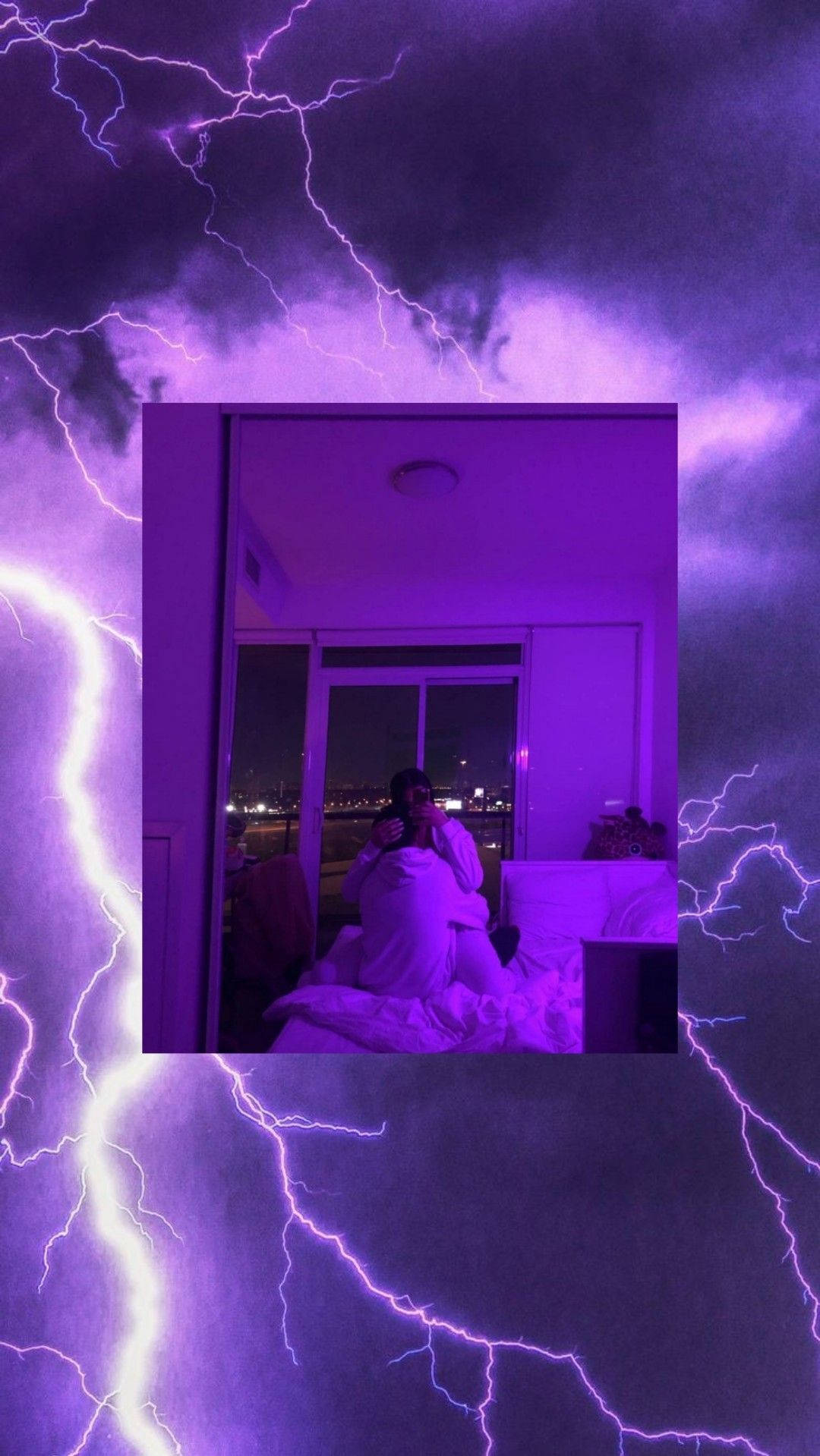 A Picture Of A Person In Bed With Lightning In The Background Wallpaper