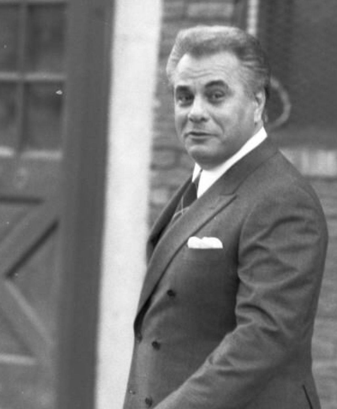 A Powerful Gaze From The Notorious John Gotti In Monochrome Wallpaper