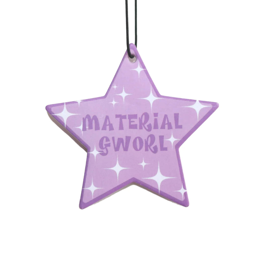 A Purple Star Ornament With The Word Material Swoosh Wallpaper