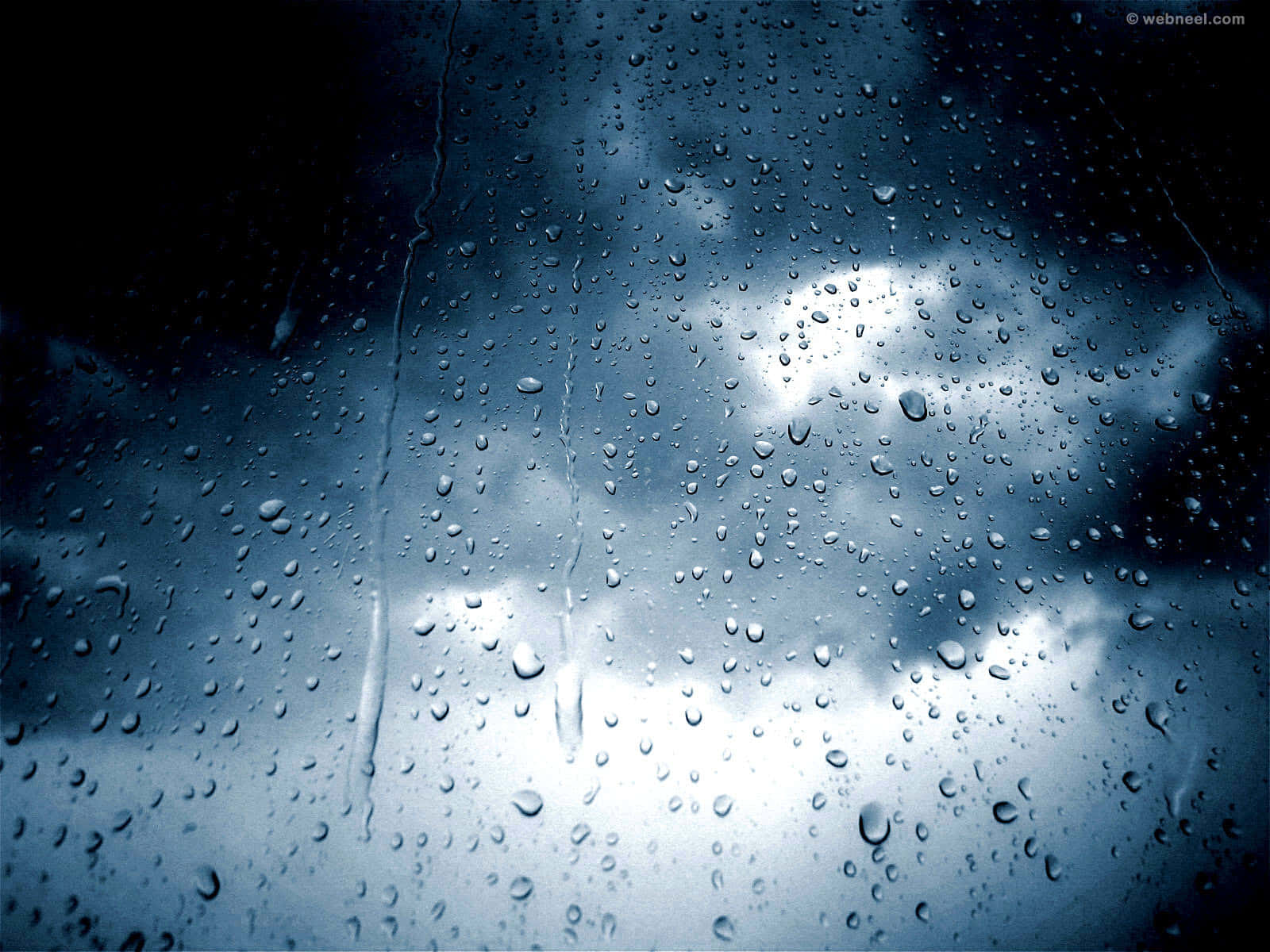 A Serene Scene Of Rainfall Wallpaper