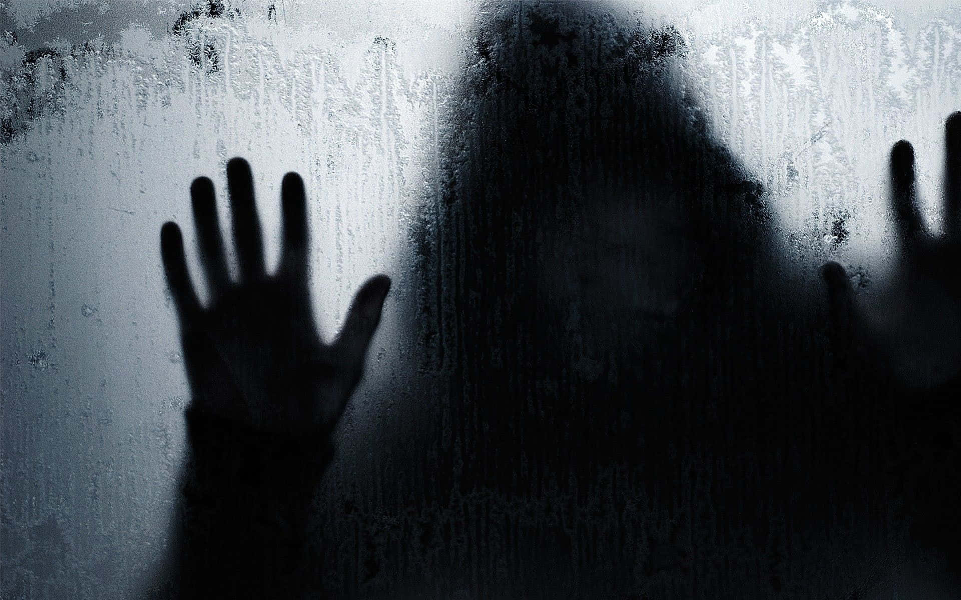 A Silhouette Of A Person With Hands Out Of The Window Wallpaper
