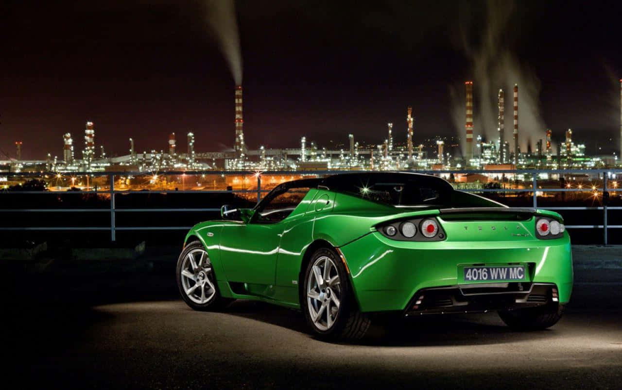 A Stunning Display Of Aerodynamic Prowess - Tesla Roadster In Full Throttle Wallpaper