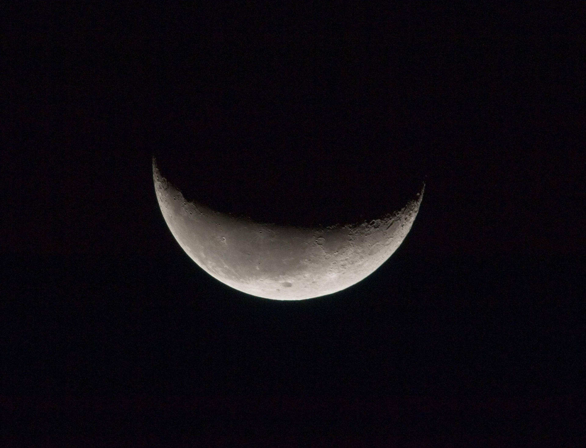 A Stunning View Of A Dark Moon Wallpaper