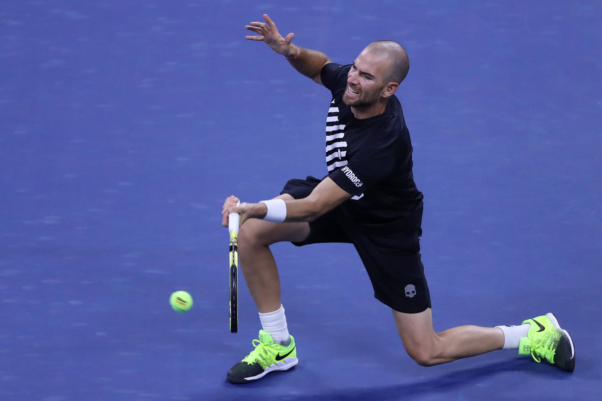 A Tennis Player Is Preparing To Hit A Ball Wallpaper