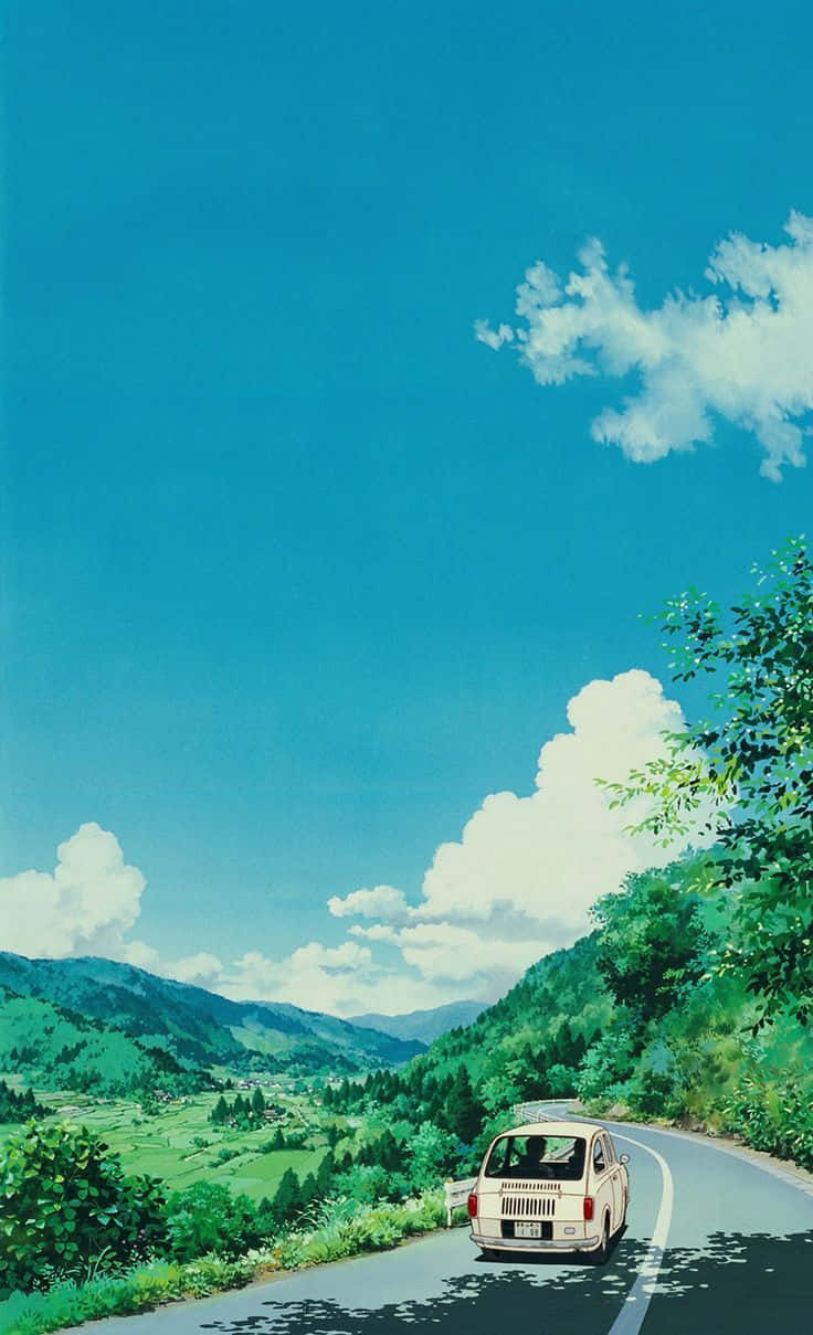 A White Car Driving Down A Road With Trees And Mountains Wallpaper