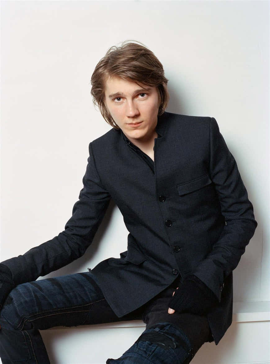 A Young Man In A Black Jacket And Jeans Wallpaper