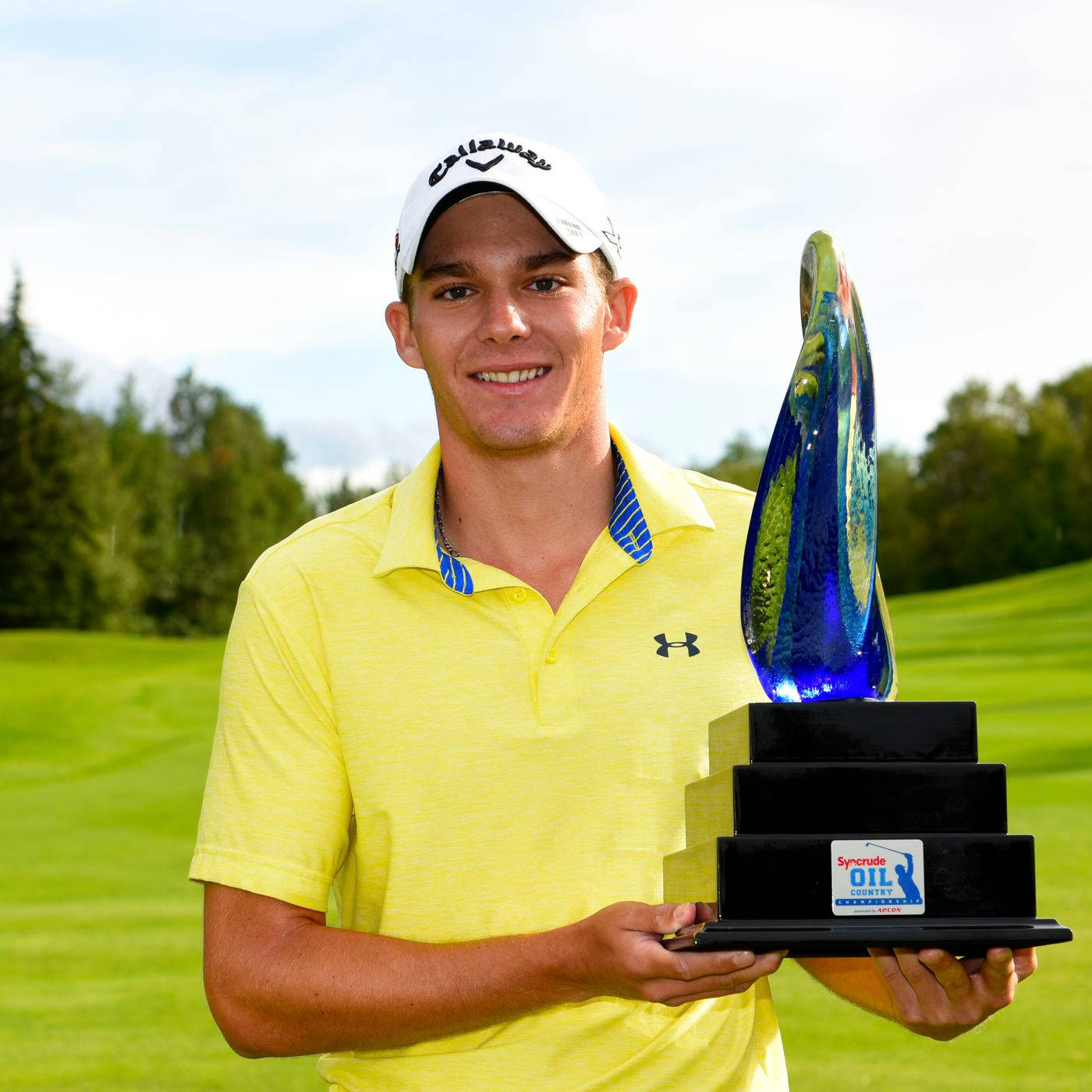 Aaron Wise Holding A Trophy Wallpaper