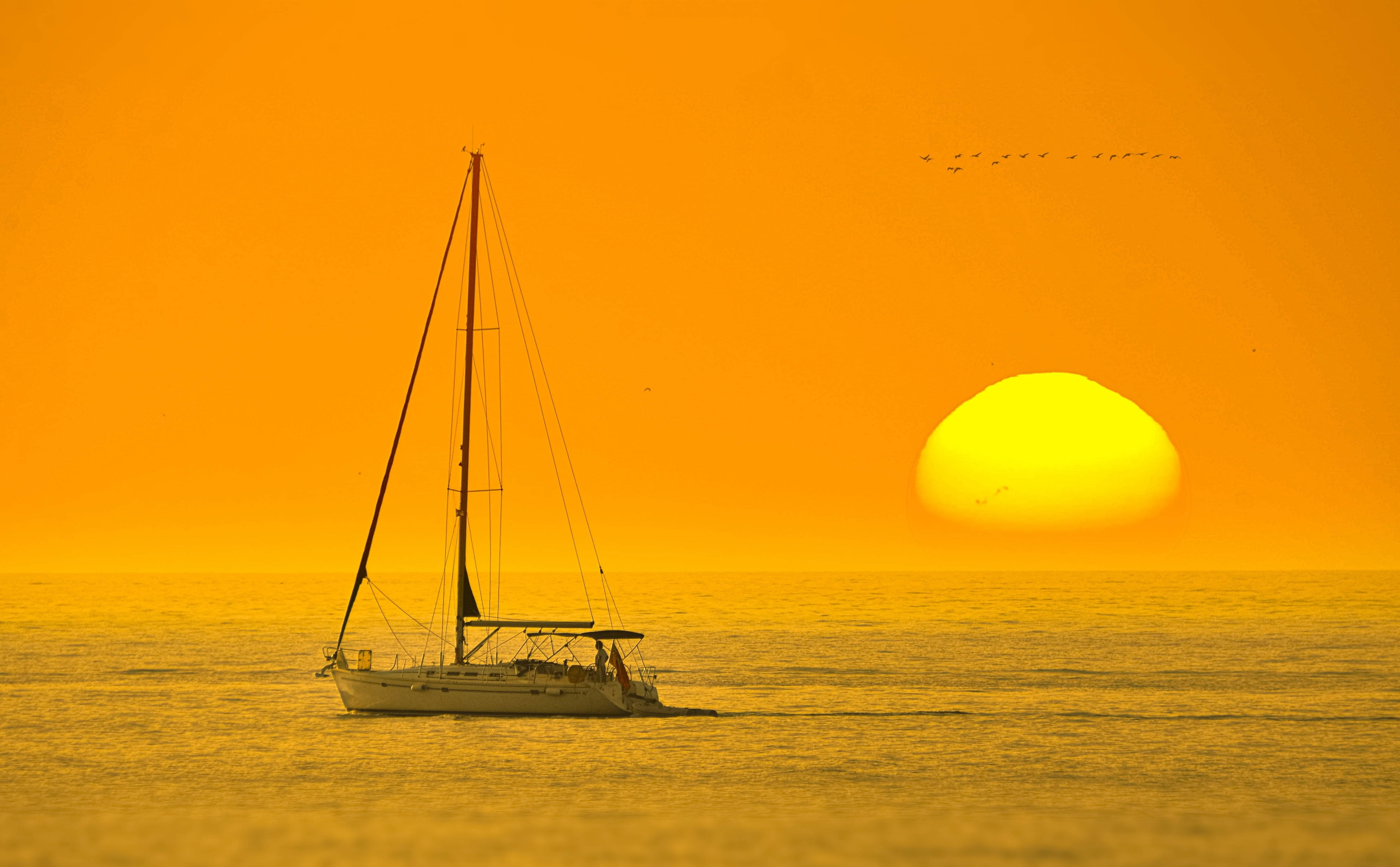 Aesthetic Sunset With A Boat Wallpaper