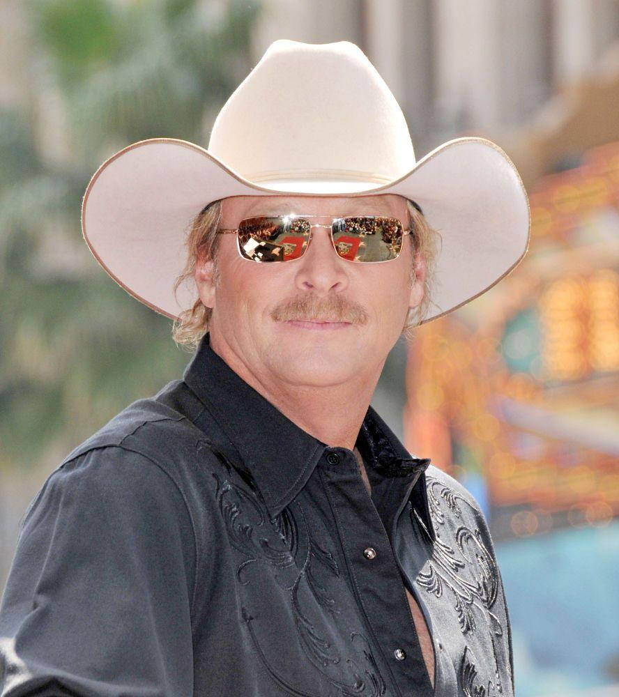 Alan Jackson In Bright Outdoor Setting Wallpaper