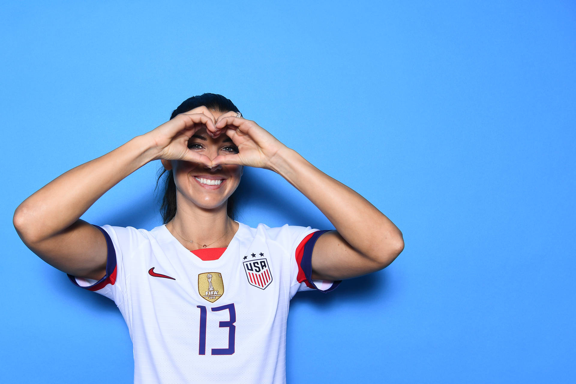 Alex Morgan Heart Pose Wallpaper