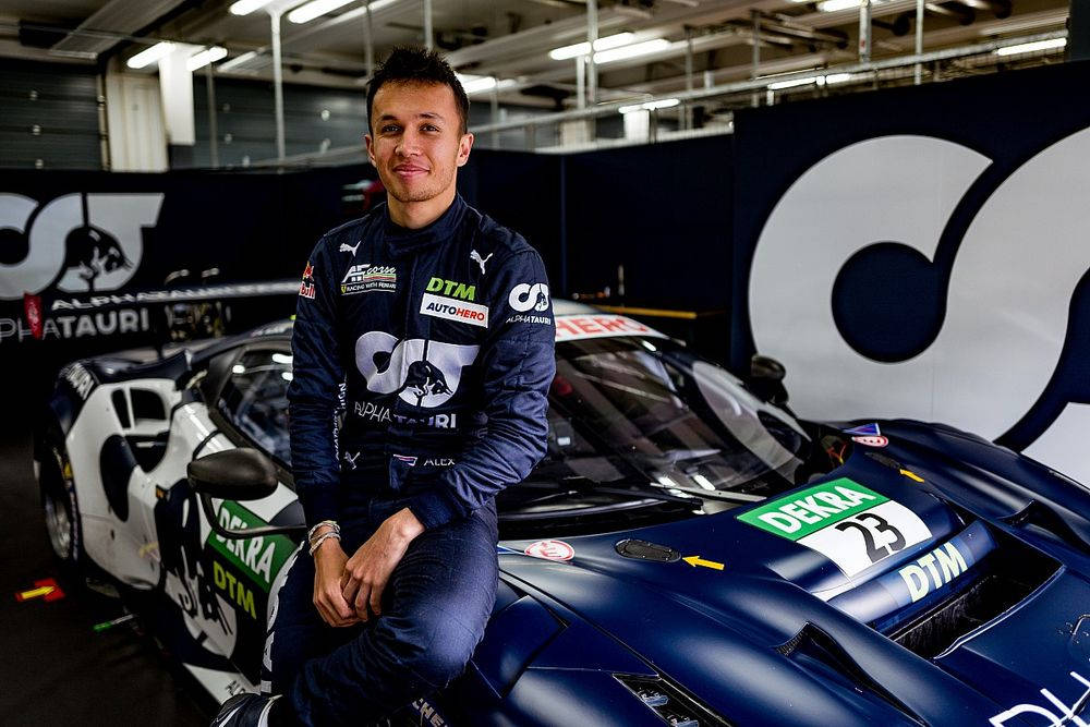 Alexander Albon Sitting On Car Wallpaper