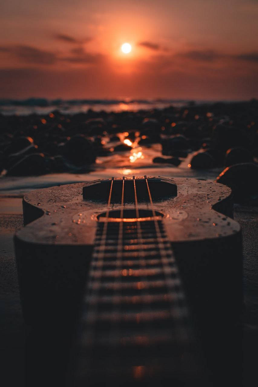 Amber Sky And Ukulele Beautiful Phone Wallpaper