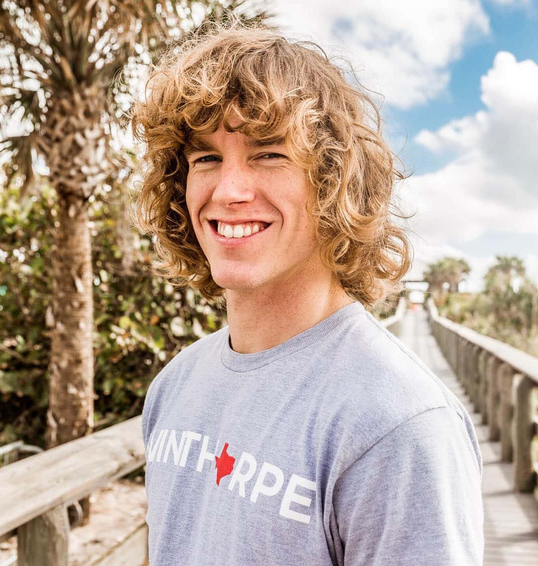 American Celebrity Danny Duncan On A Wooden Pathway Wallpaper