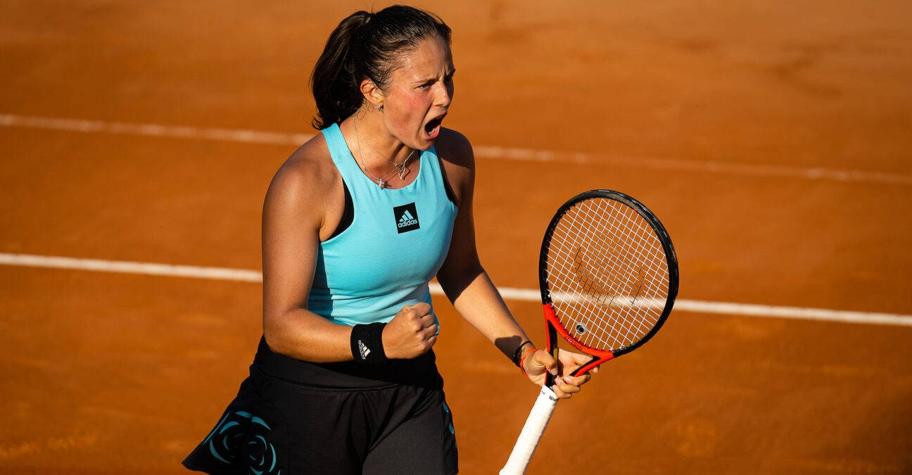 An Exhilarated Daria Kasatkina Celebrating Victory In Blue Wallpaper