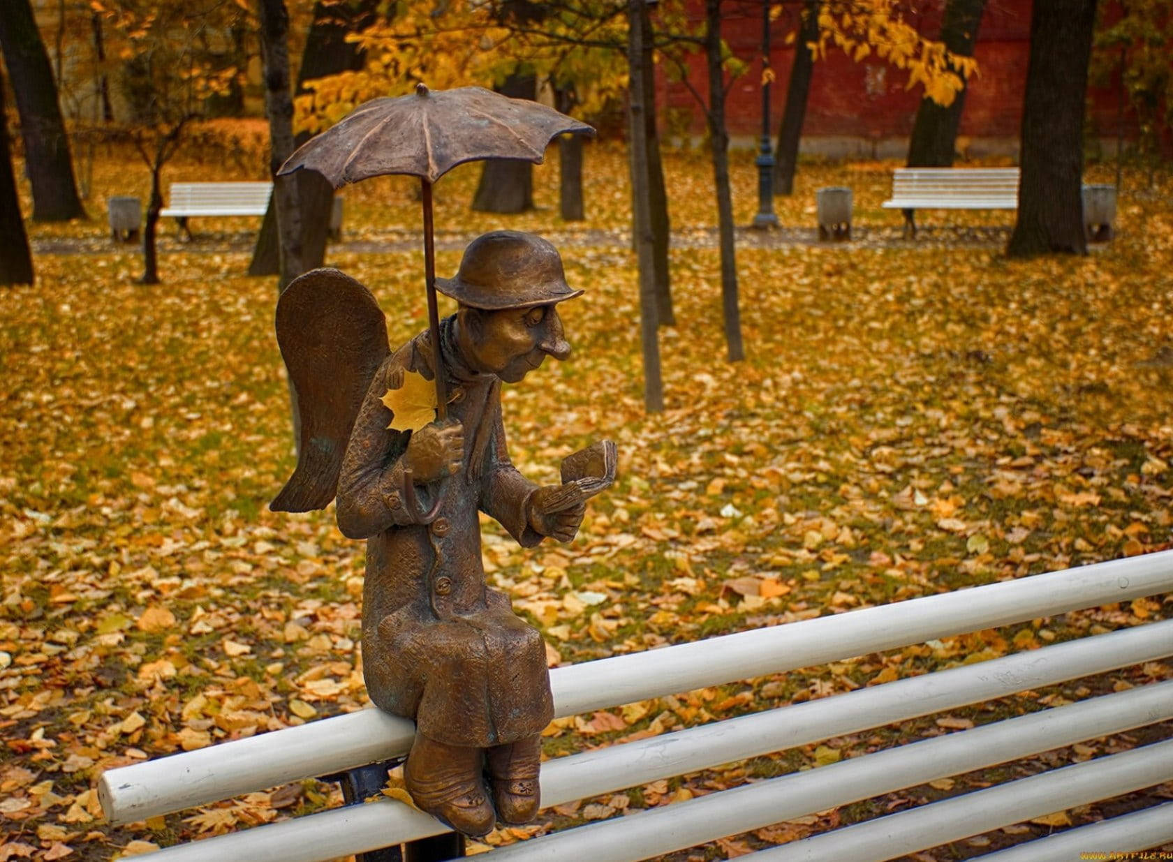 Angel Statue Reading A Book Wallpaper