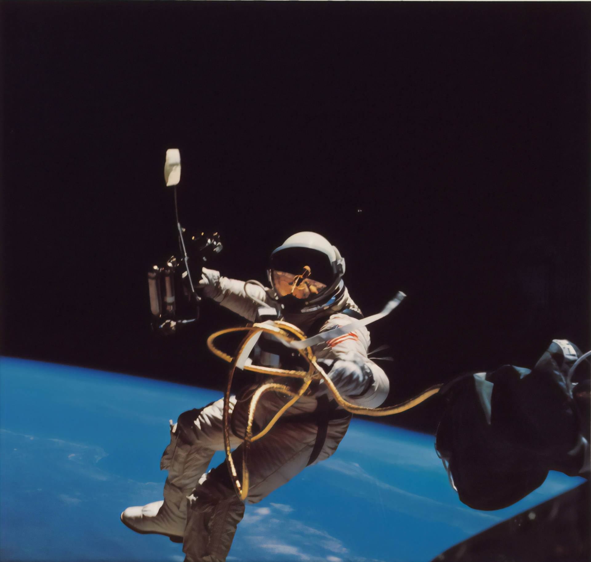 Astronaut In Space Holding Space Tools Wallpaper