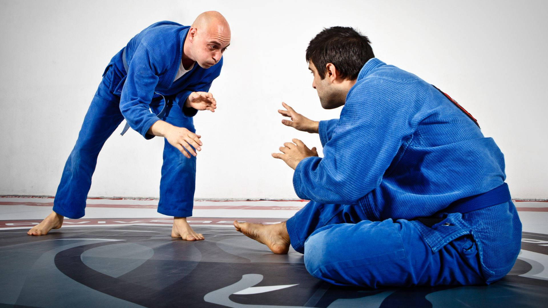 Athletic Brazilian Jiu-jitsu Fighter In Action Wallpaper