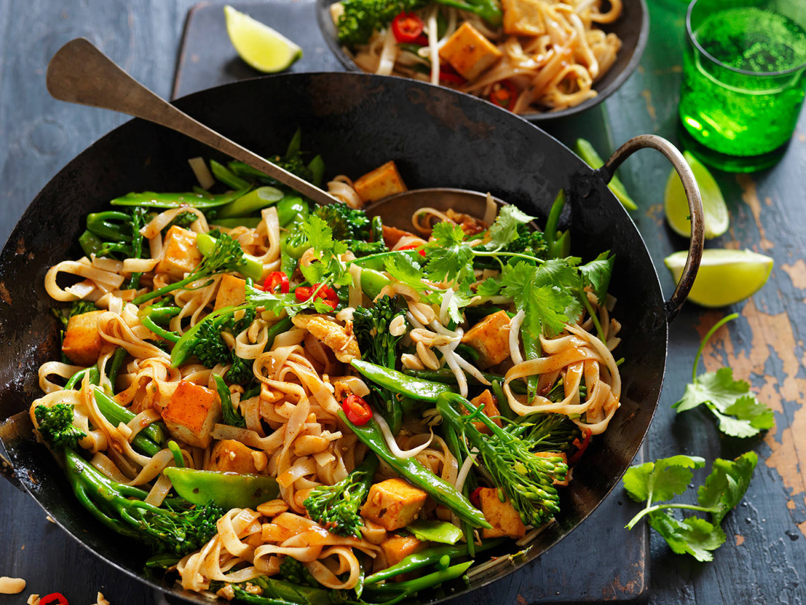 Authentic Pad Thai Noodles Tossed With Fresh Greens Wallpaper