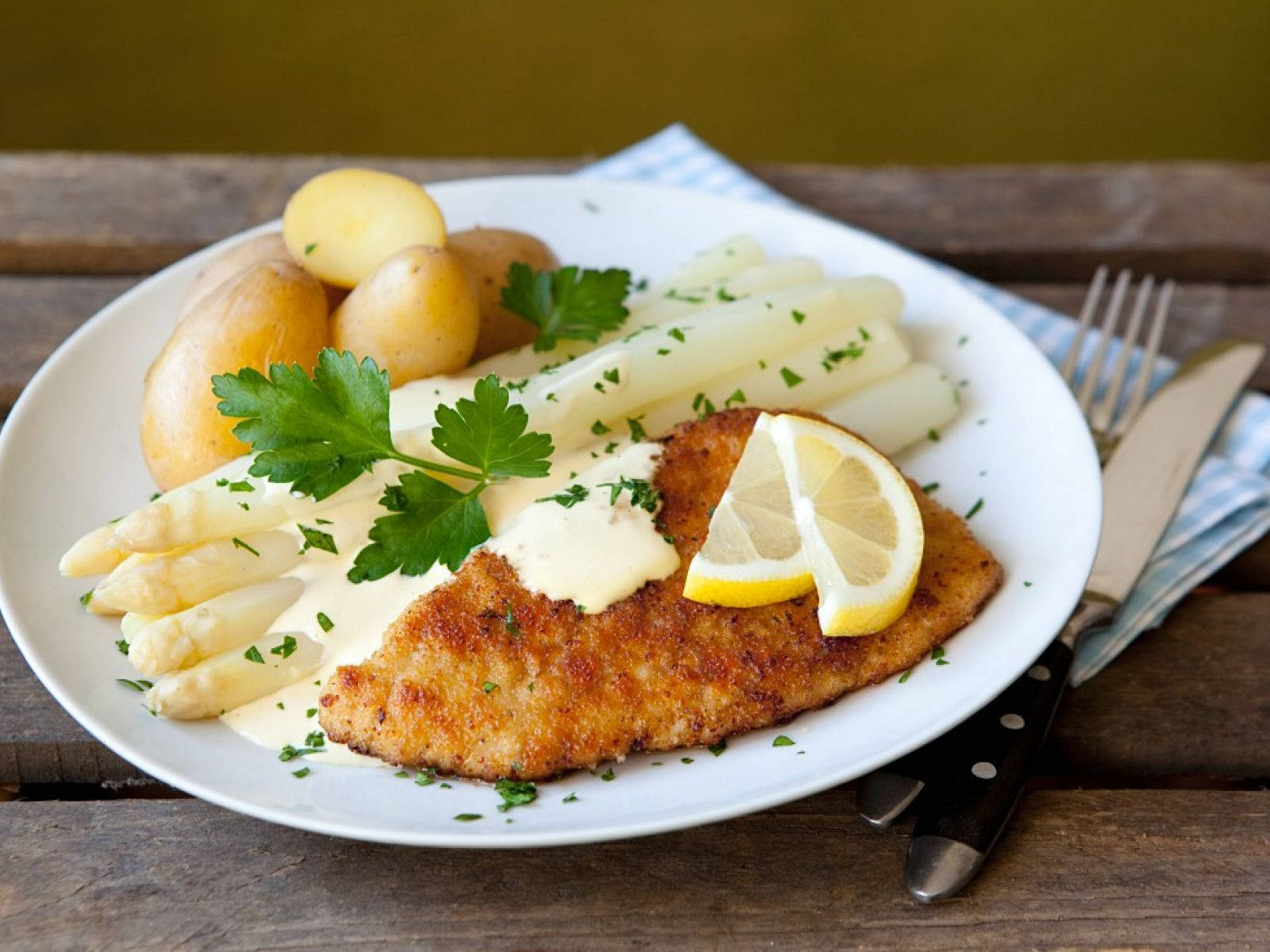 Authentic Wiener Schnitzel Served On A White Dish Wallpaper