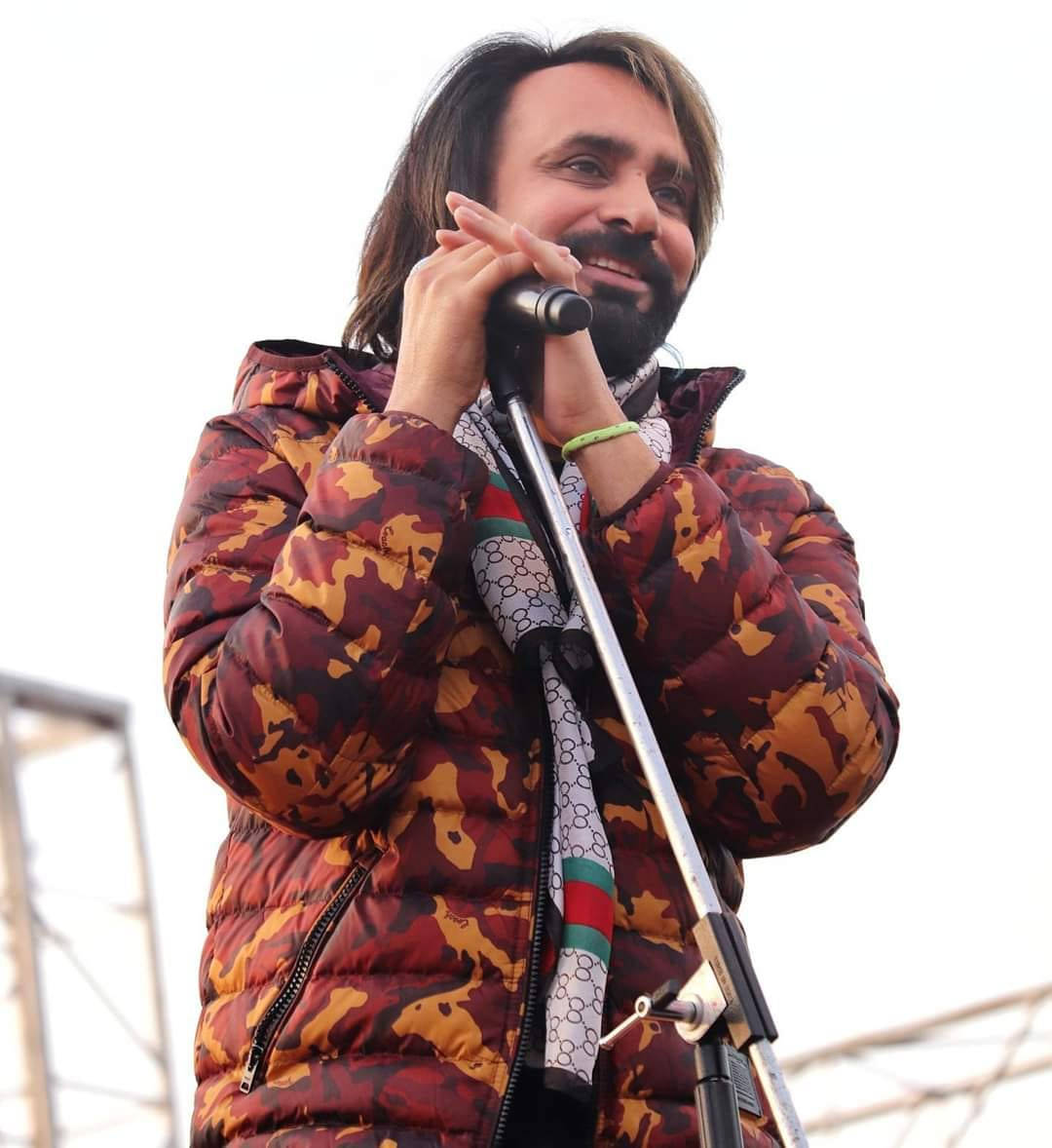 Babbu Maan In Stylish Red Puffy Jacket Wallpaper