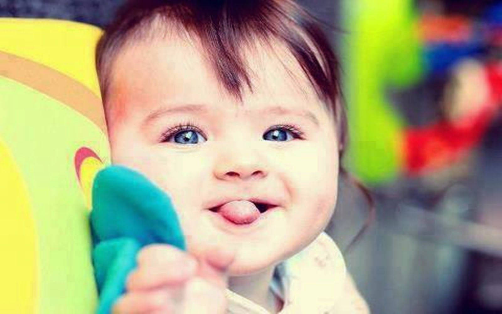 Baby Sticking Tongue Out Wallpaper