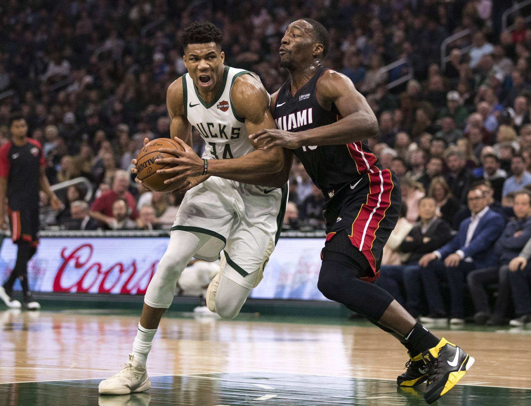 Bam Adebayo Guarding Giannis Antetokounmpo Wallpaper