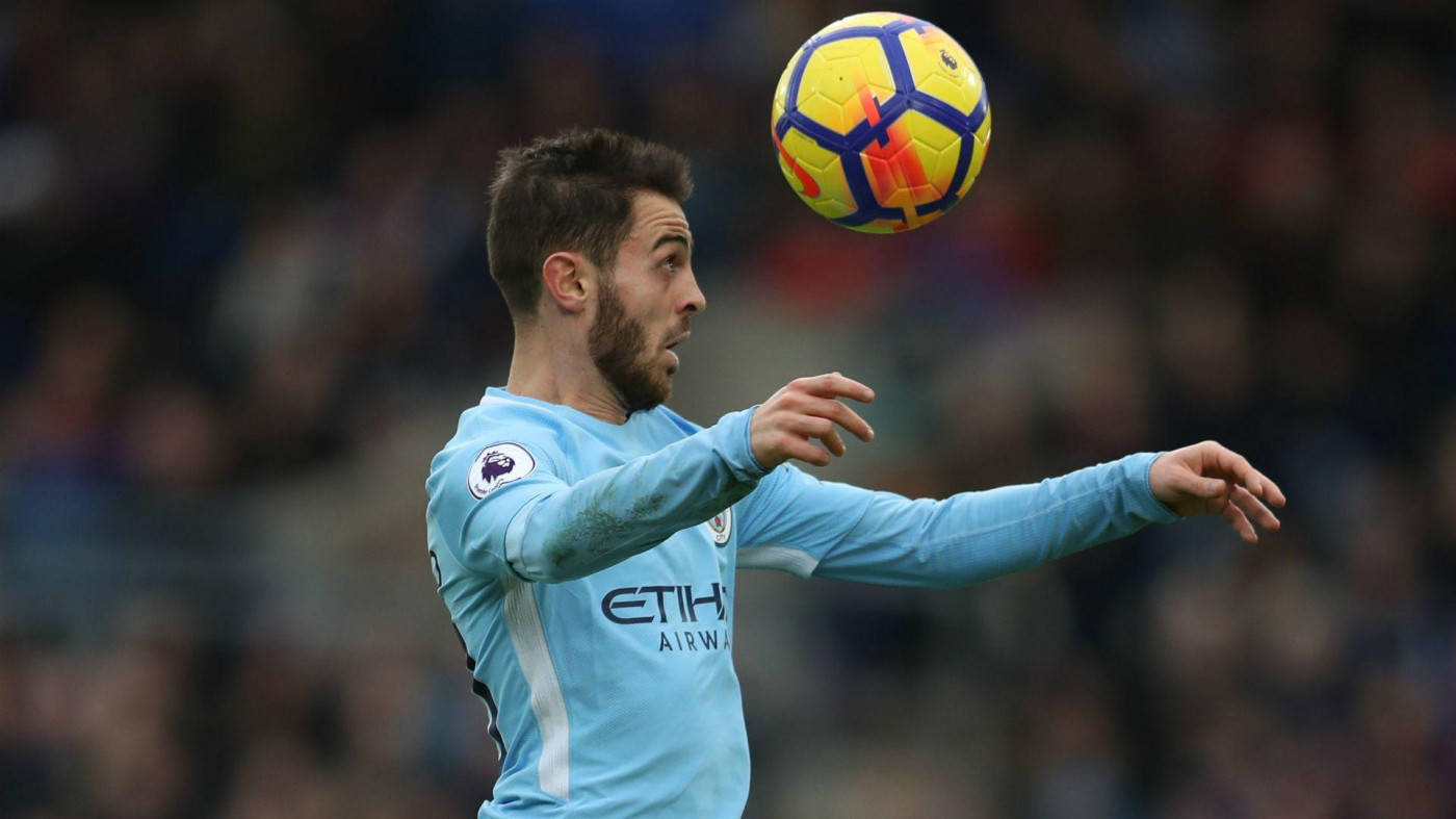 Bernardo Silva Expertly Anticipates To Head The Ball In A Match Wallpaper