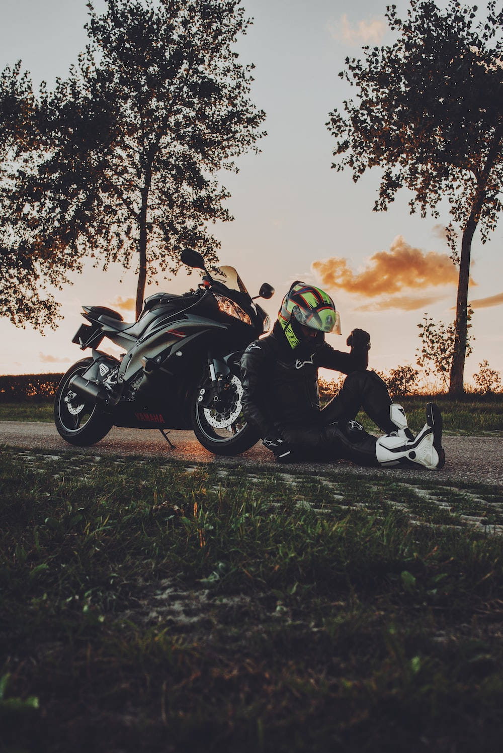 Bike Lover On A Dramatic Sunset Wallpaper