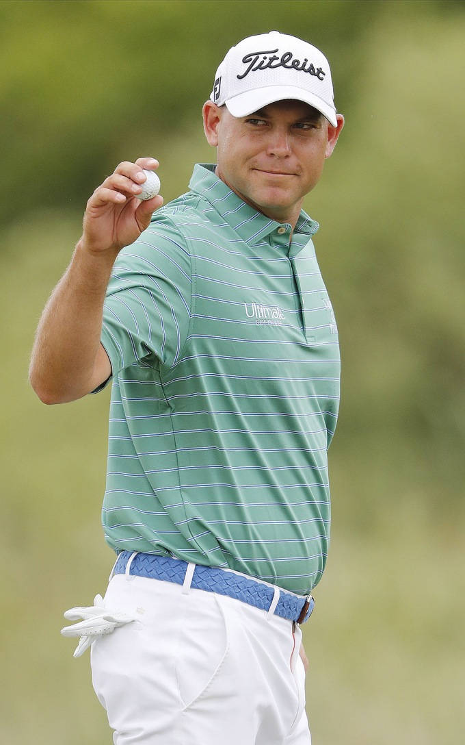 Bill Haas Holding A Golf Ball Wallpaper