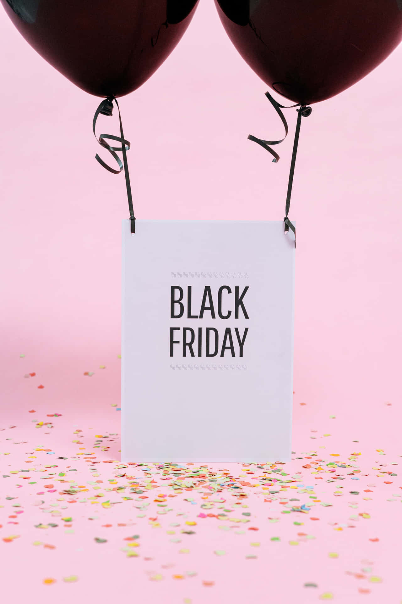 Black Friday Balloons With Confetti On Pink Background Wallpaper