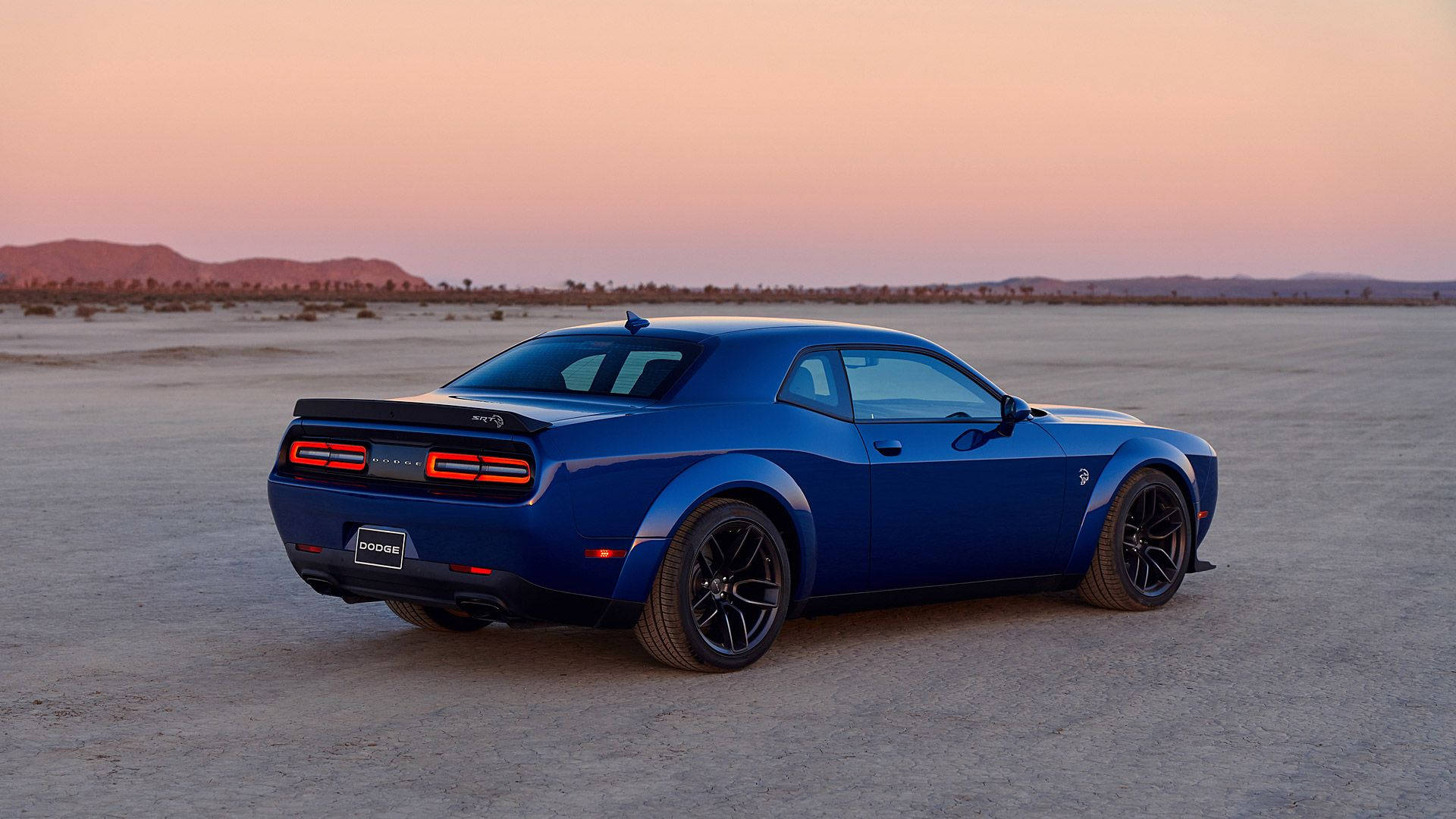 Blue Dodge Challenger On Sandy Road Wallpaper