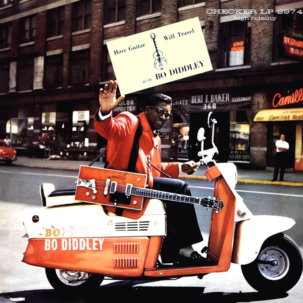 Bo Diddley Riding Orange Motorcycle Wallpaper