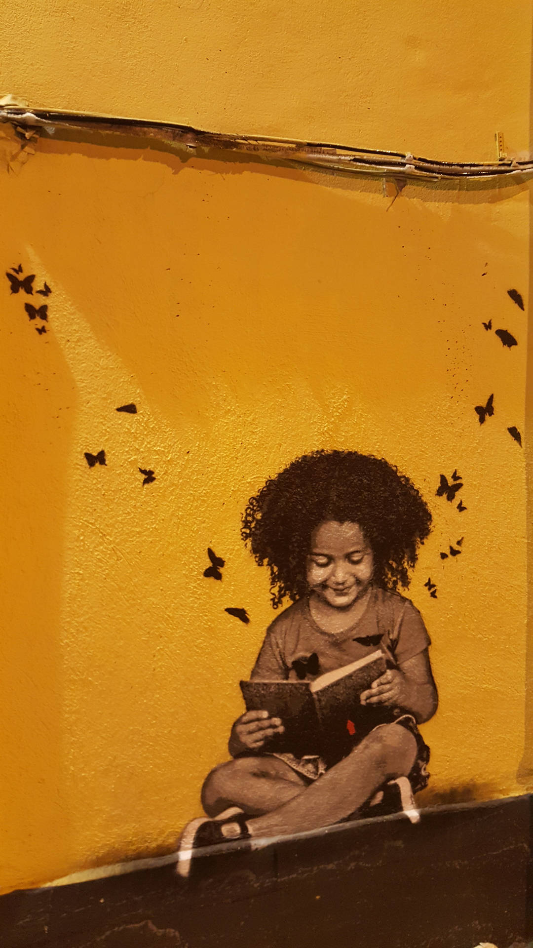 Bookworm Kid Artfully Expresses Themselves Through Street Art Wallpaper
