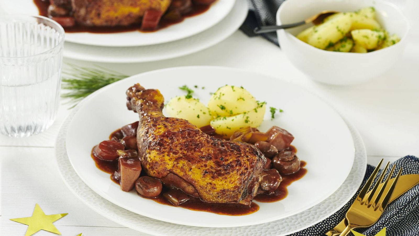 Braised Chicken Coq Au Vin Garnished On A Plate Wallpaper