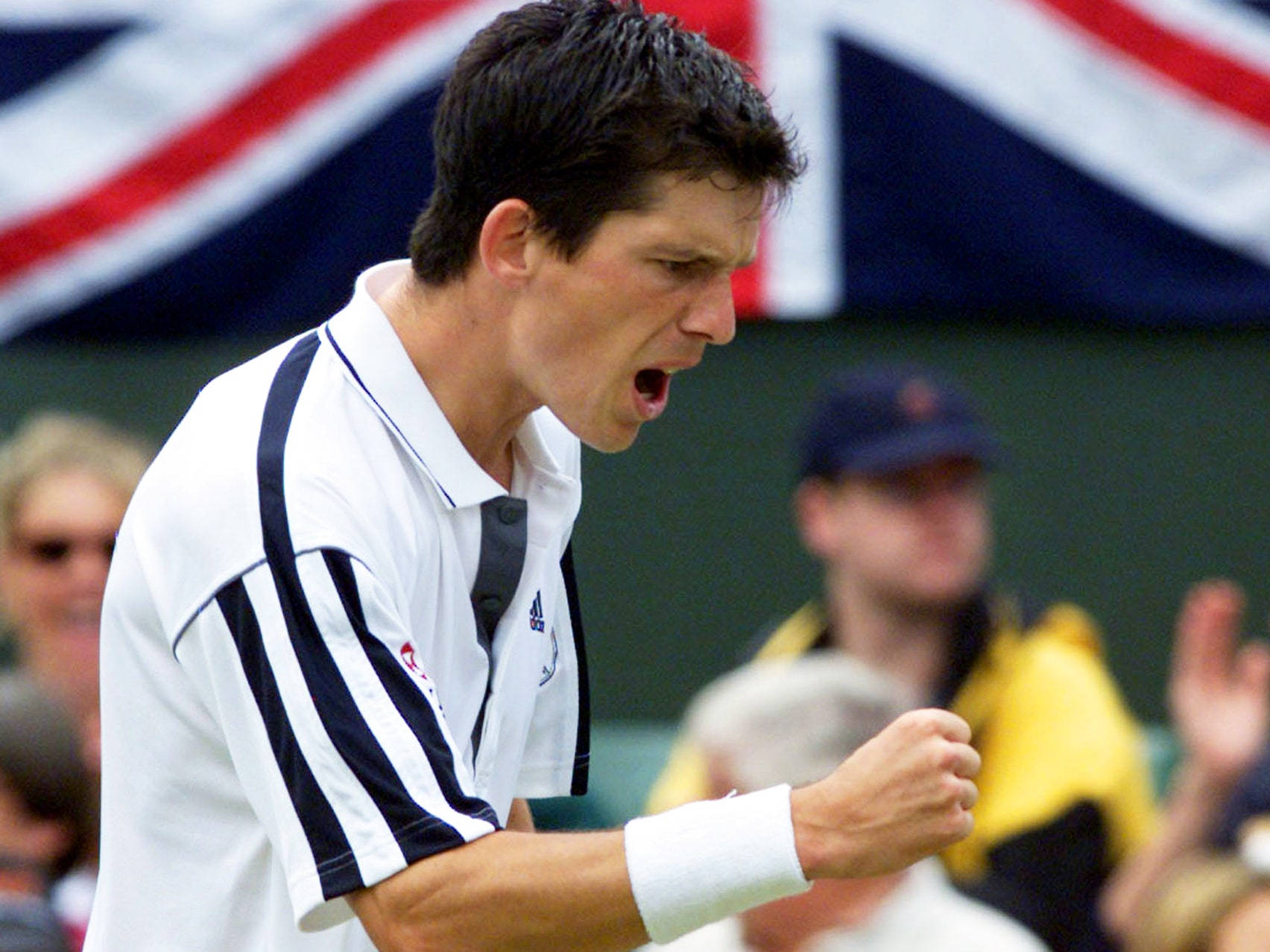 British Tennis Icon Tim Henman Celebrating Victory With Clenched Fist. Wallpaper