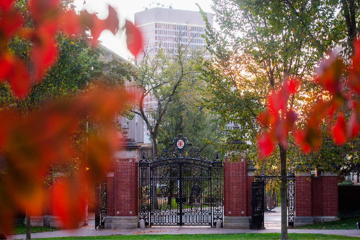 Brown University Gates With Red Blurry Leaves Wallpaper