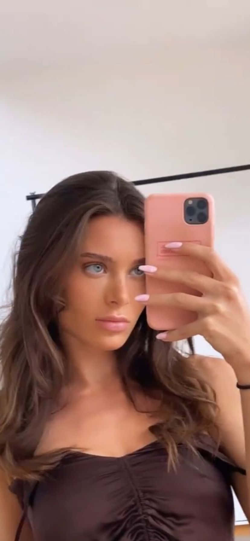 Brunette Selfiewith Pink Phone Wallpaper