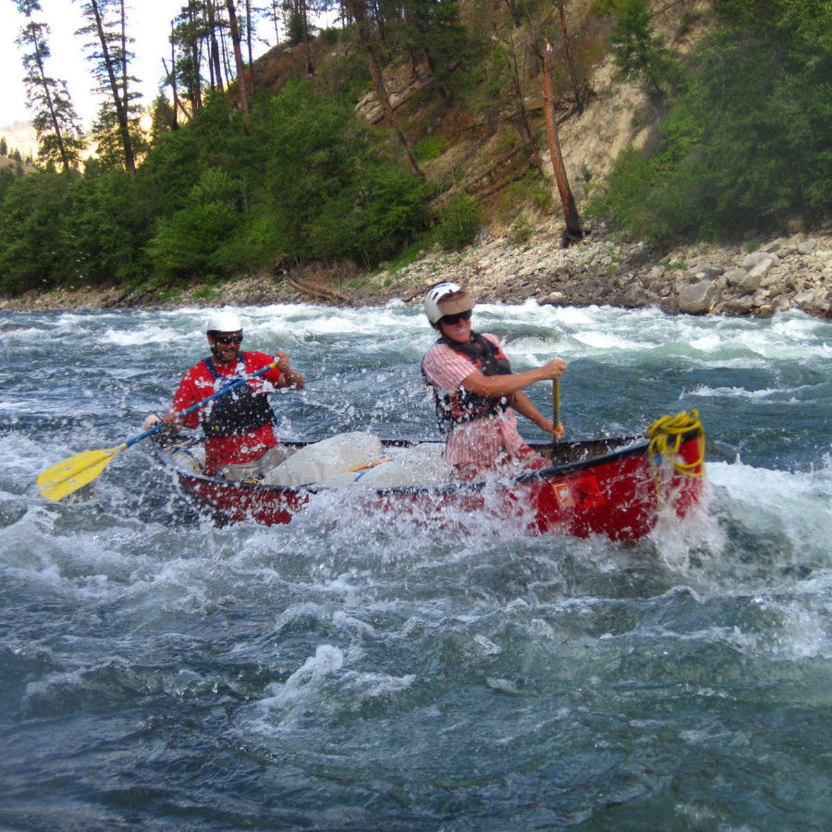 Canoeing In Strong Waves Of The River Wallpaper