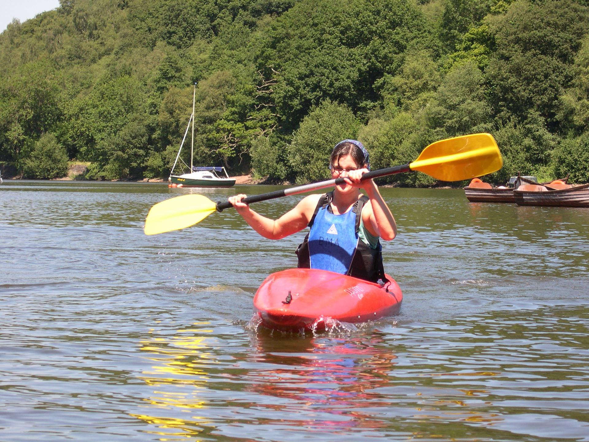 Canoeing Woman Holding A Paddle Wallpaper