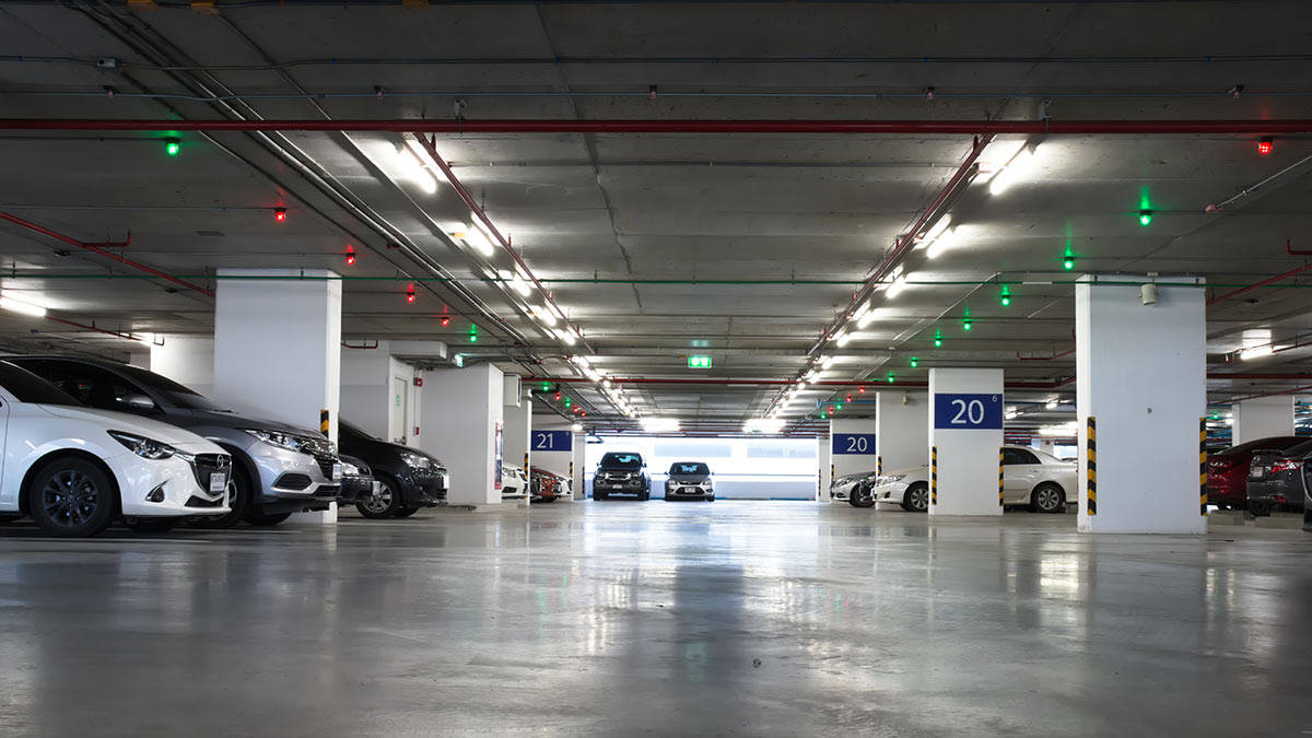 Caption: A Low-angle View In An Underground Parking Garage Wallpaper