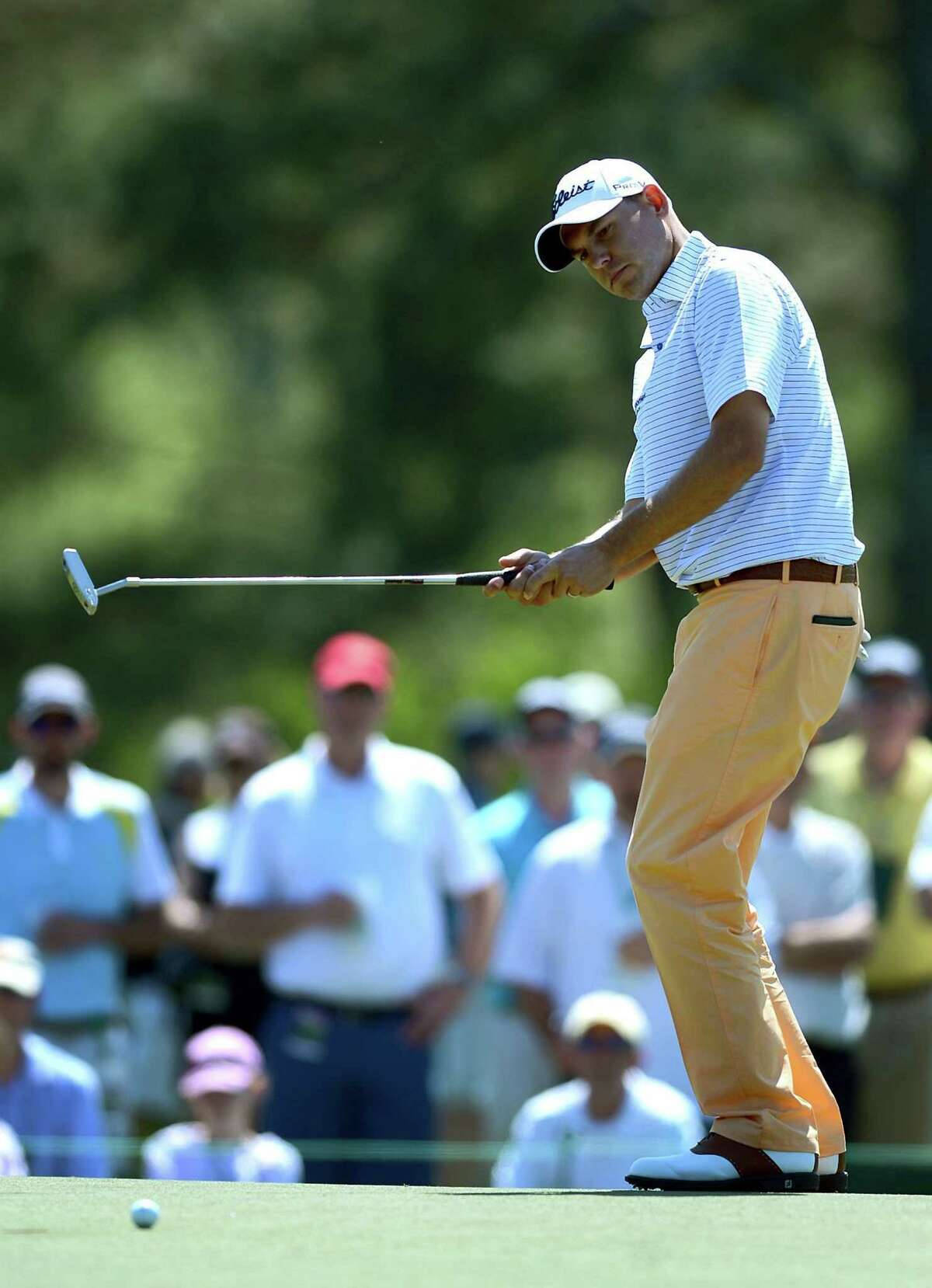 Caption: Bill Haas Focused On The Flying Golf Ball Wallpaper