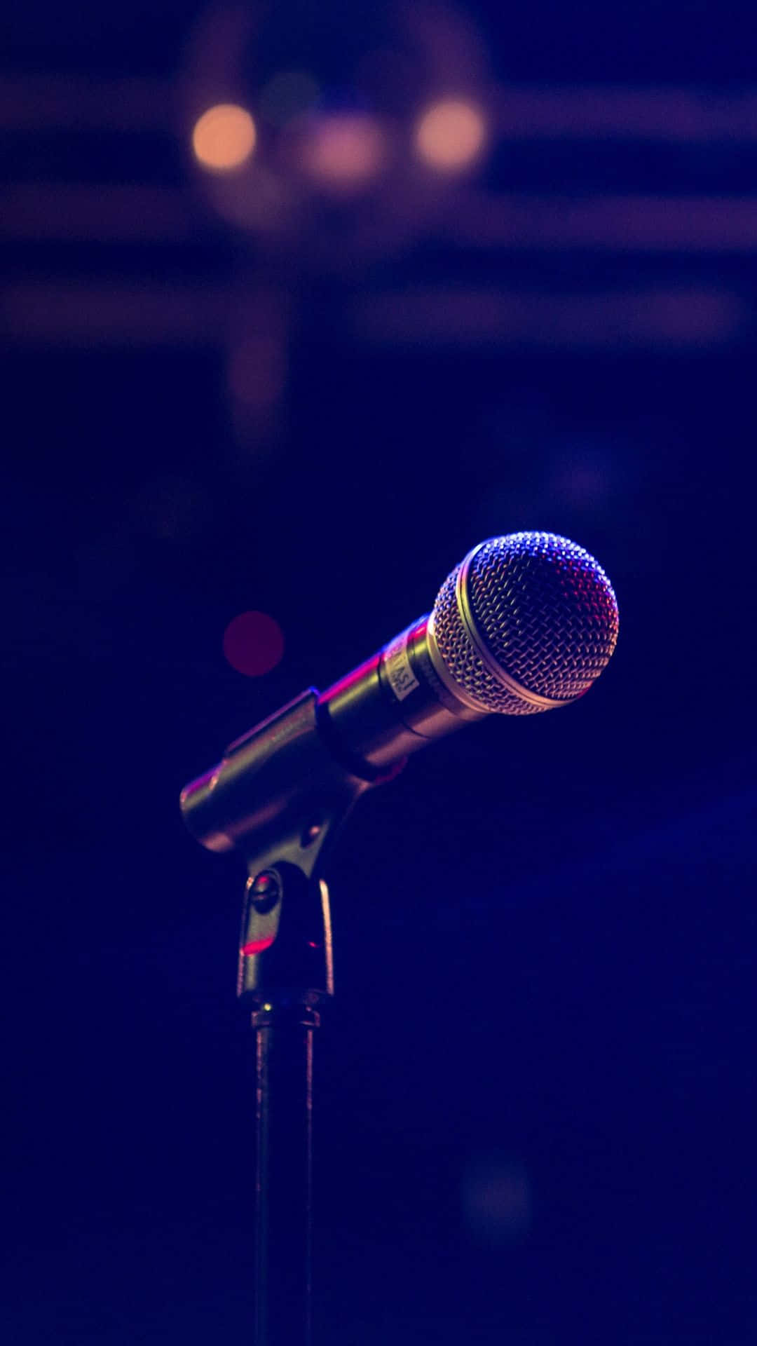 Caption: Dynamic Microphone Ready For Performance Wallpaper