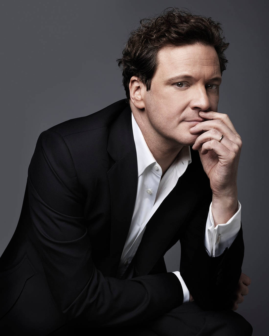 Caption: English Actor Colin Firth In A Classy Portrait Wallpaper